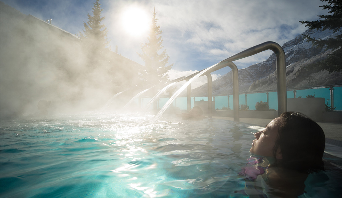 Woman relaxing in a Badenhaus spa pool
